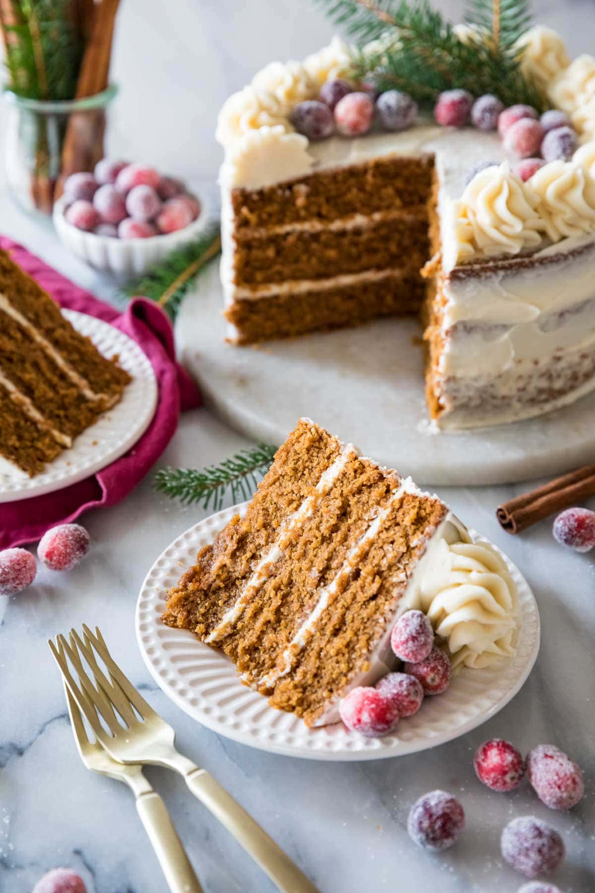 Two slices of cake cut from a three layer gingerbread cake.