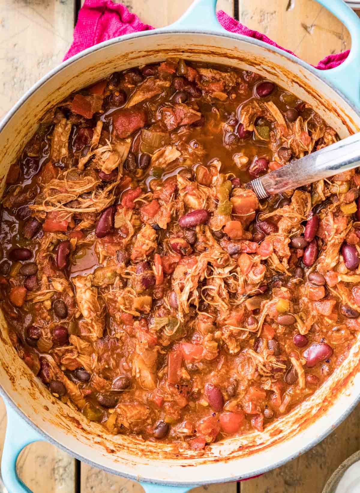 Overhead view of chili made with shredded turkey, beans, and more.