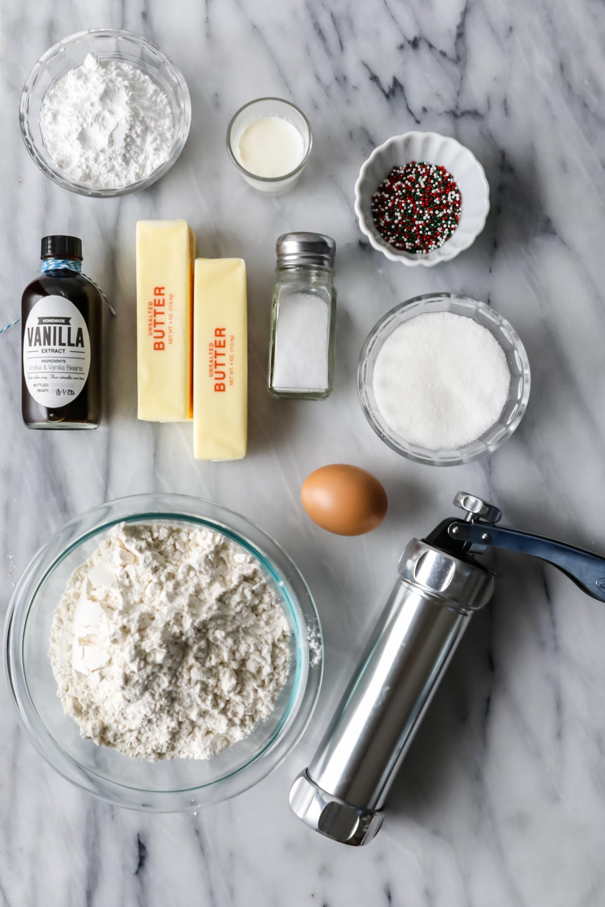 Overhead view of ingredients including flour, butter, sugar, and more.