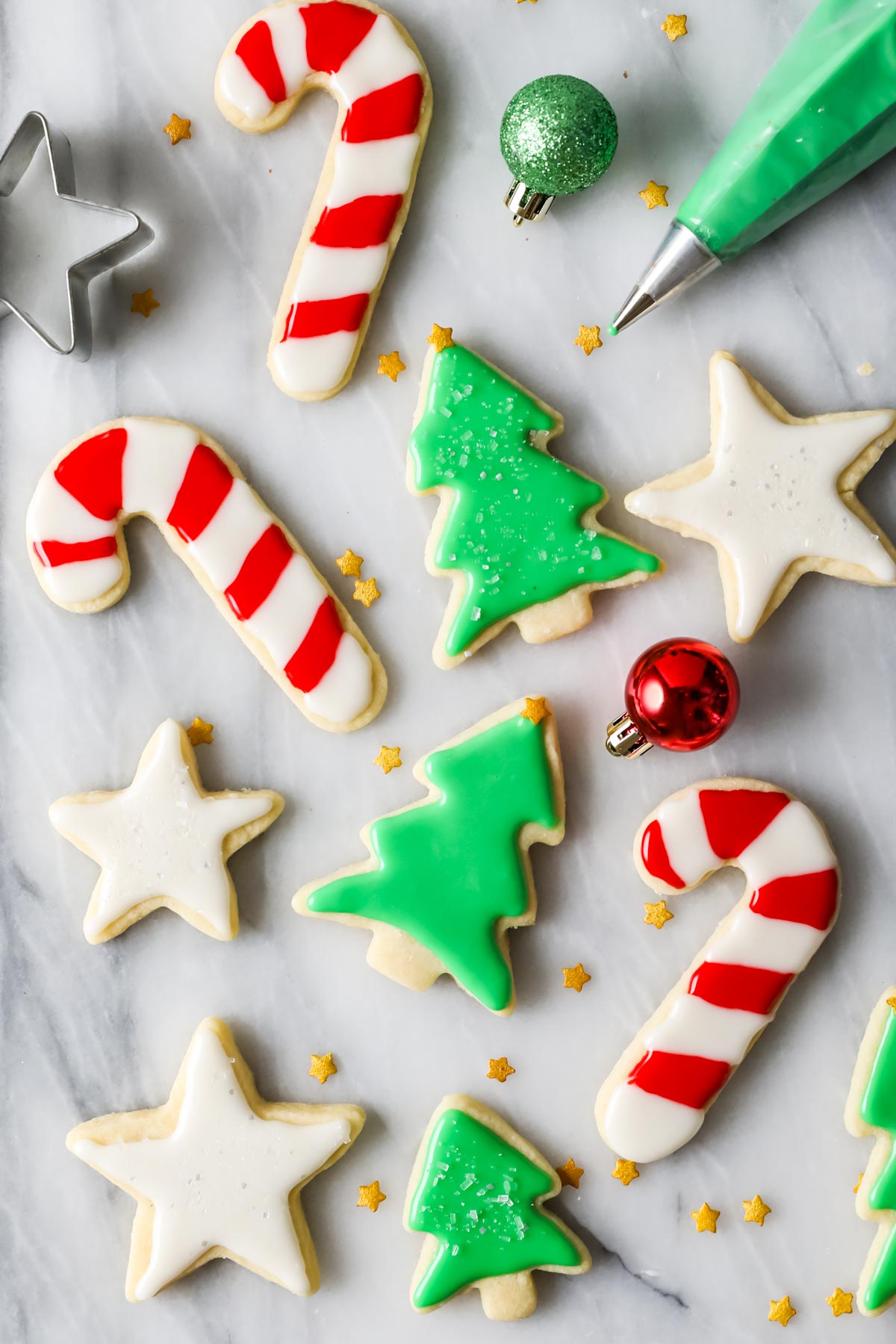 Overhead view of Christmas cookies frosted with an easy sugar cookie icing recipe.