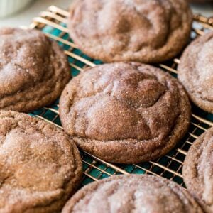 Chocolate snickerdoodles on a cooling rack after baking.