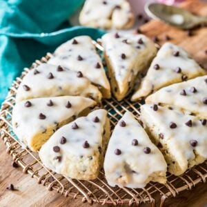 Triangular chocolate chip scones arranged in a circle on a cooling rack.