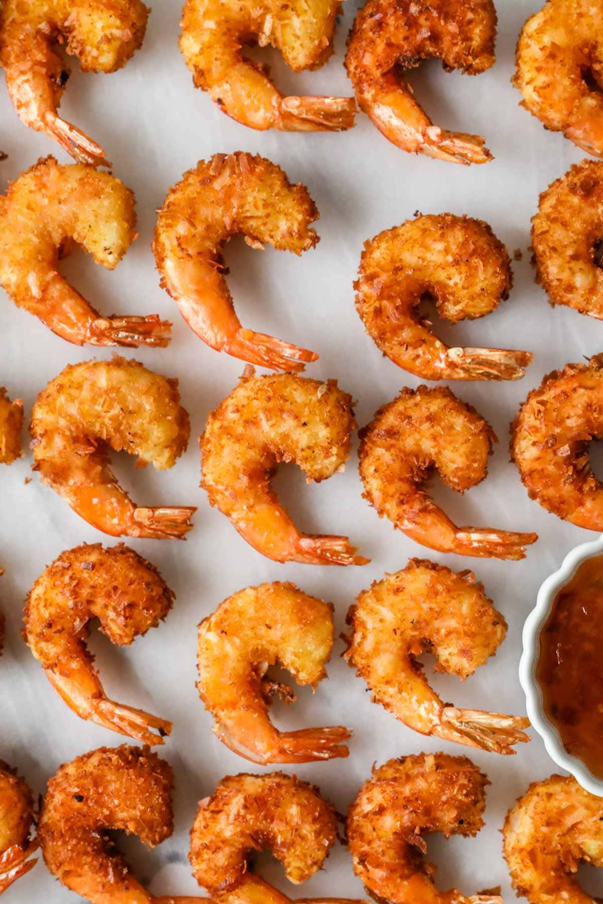 Shrimp lined up in rows after frying.