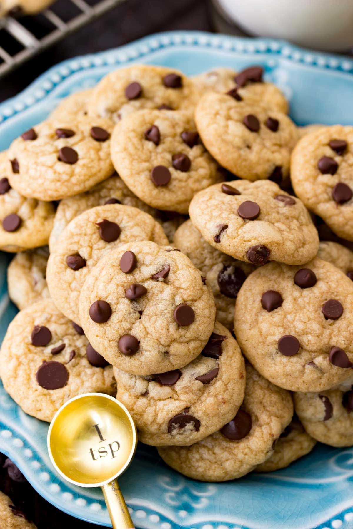Close-up view of small chocolate chip cookies topped with mini chips.