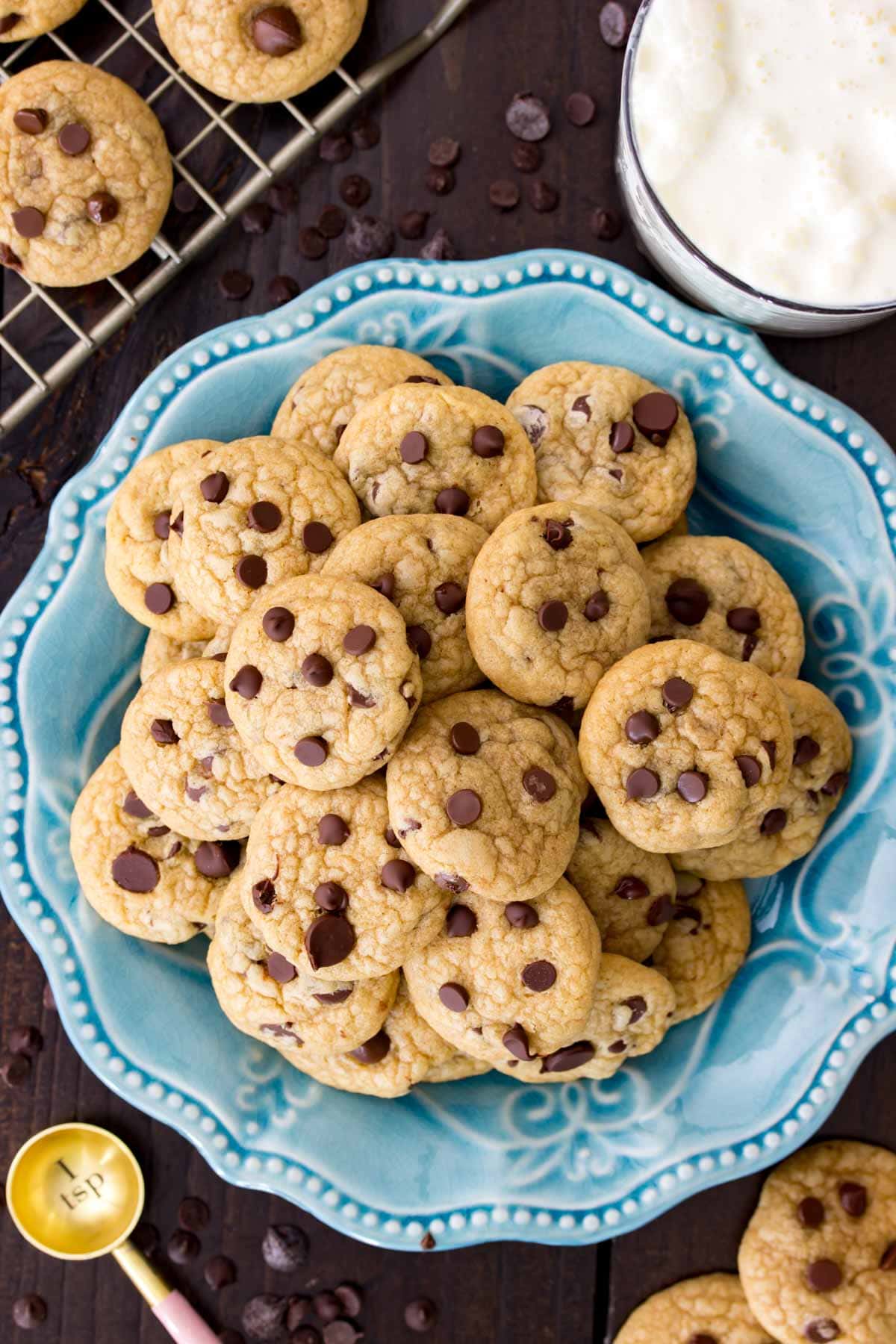 Overhead view of mini chocolate chip cookies on a plate.