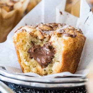 Nutella muffin bitten to show a nutella filling.