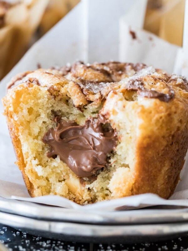 Nutella muffin bitten to show a nutella filling.