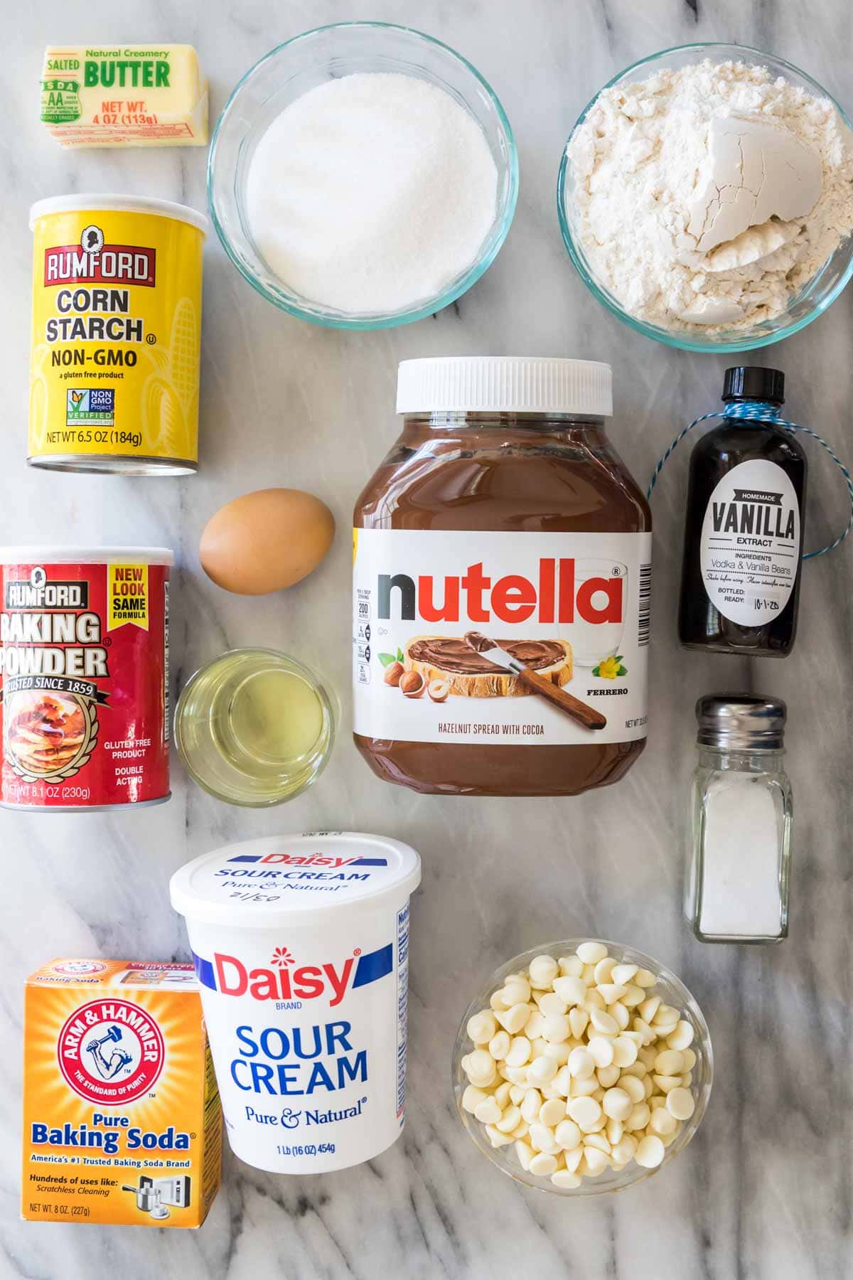 Overhead view of ingredients including corn starch, nutella, sour cream, and more.