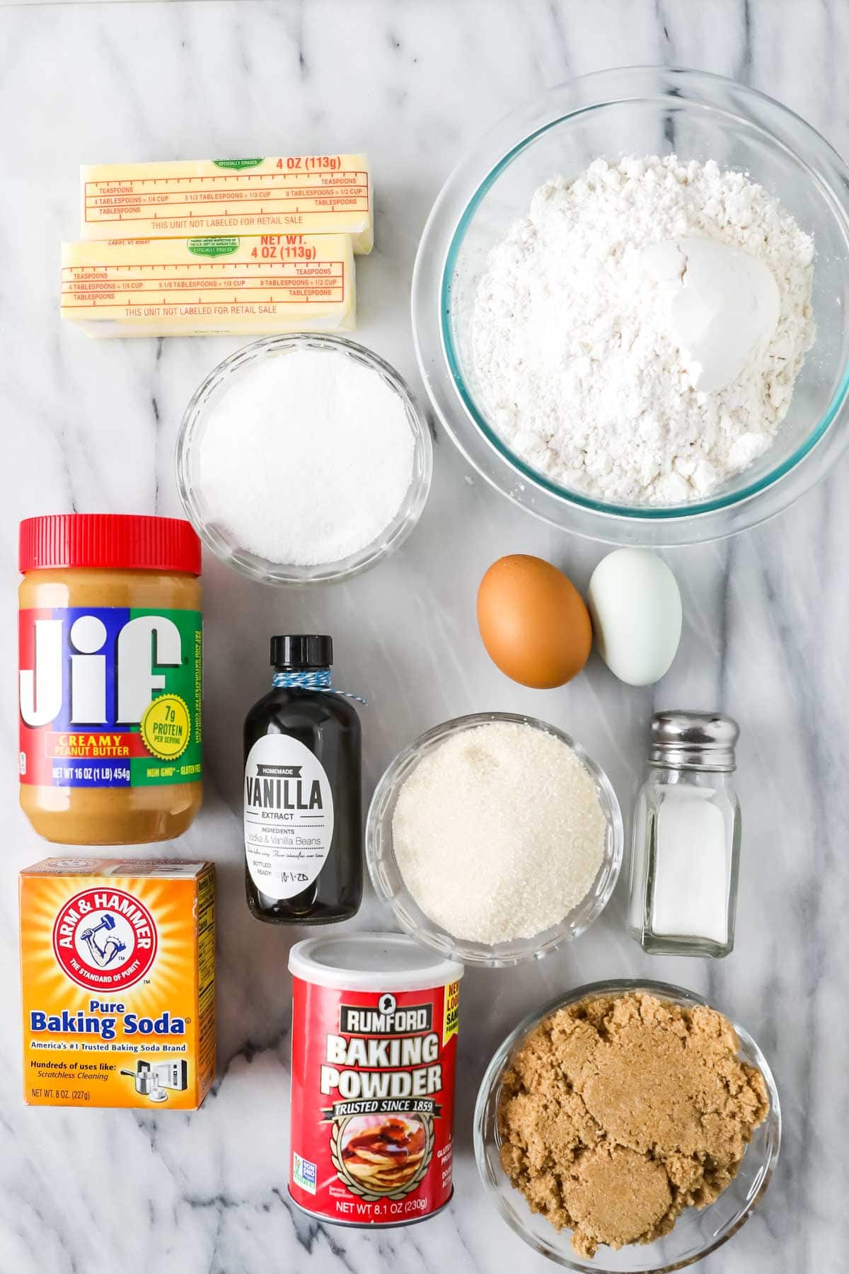 Overhead view of ingredients including peanut butter, butter, brown sugar, and more.