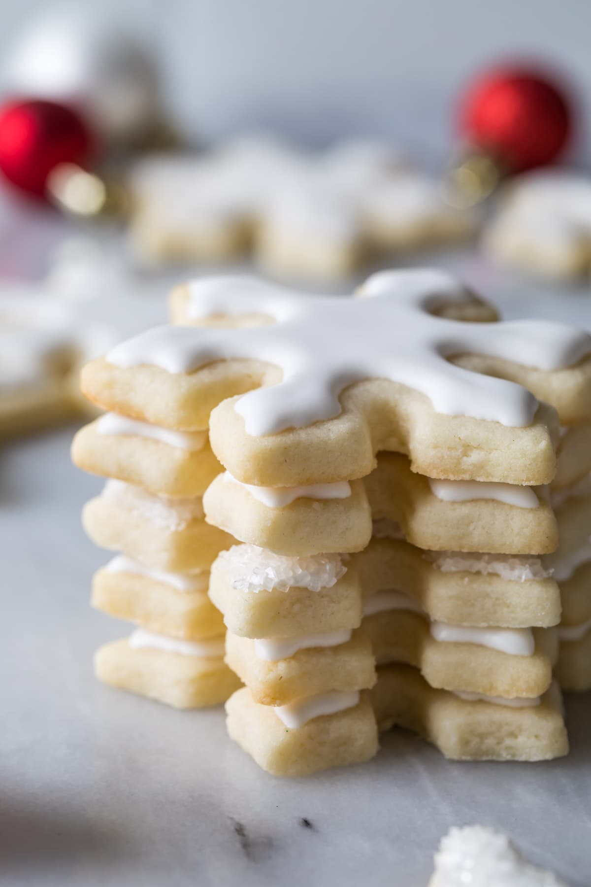 close-up of edges of baked and frosted no-chill sugar cookies, stacked