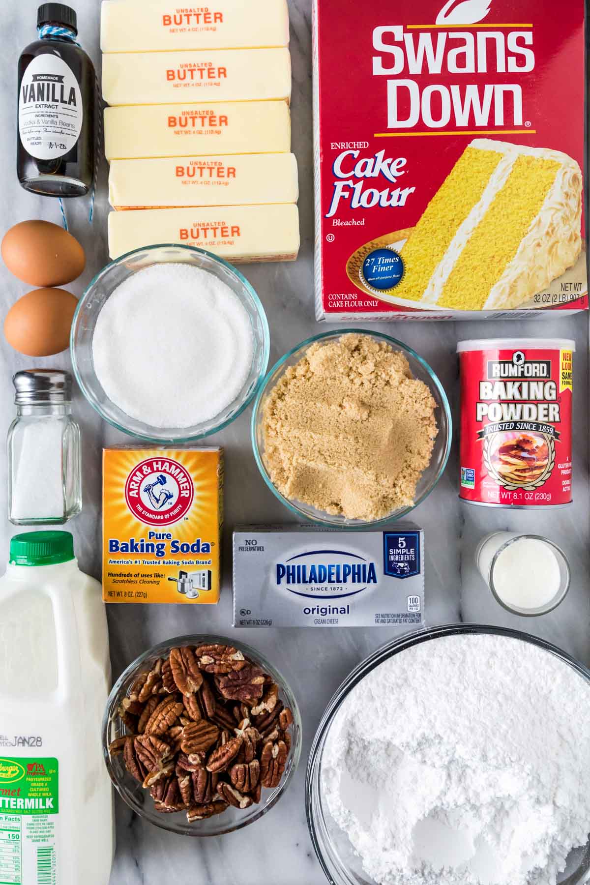 Overhead view of ingredients including cake flour, butter, pecans, buttermilk, and more.