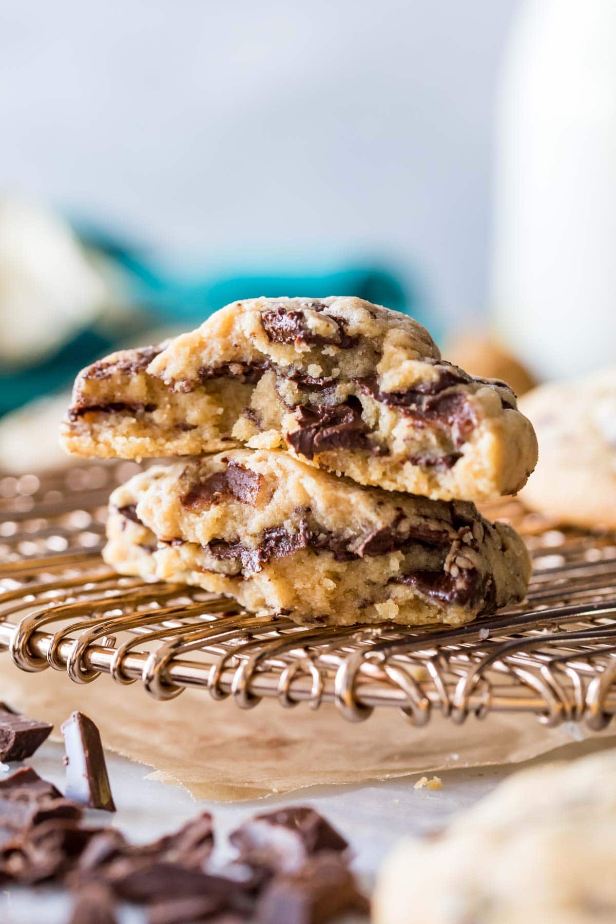 Two halves of a peanut butter chocolate chunk cookie stacked on top of each other.