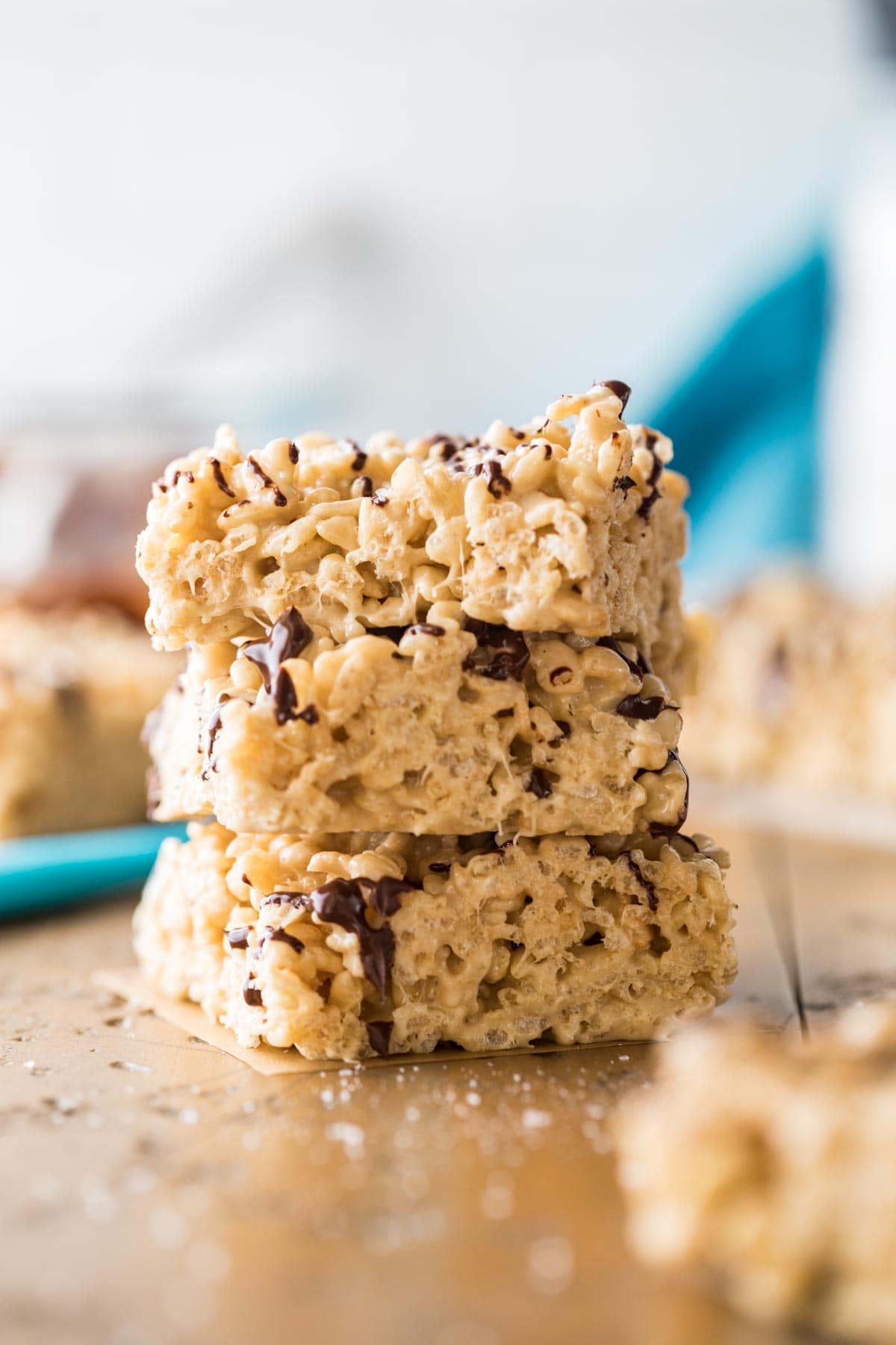 Three stacked salted caramel rice krispie treats.