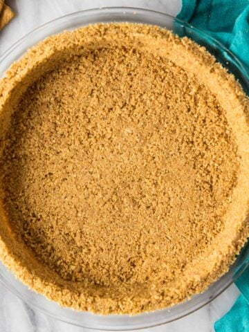Overhead view of a smooth crust made from a homemade graham cracker crust recipe.