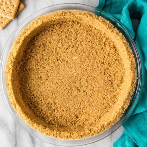 Overhead view of a smooth crust made from a homemade graham cracker crust recipe.