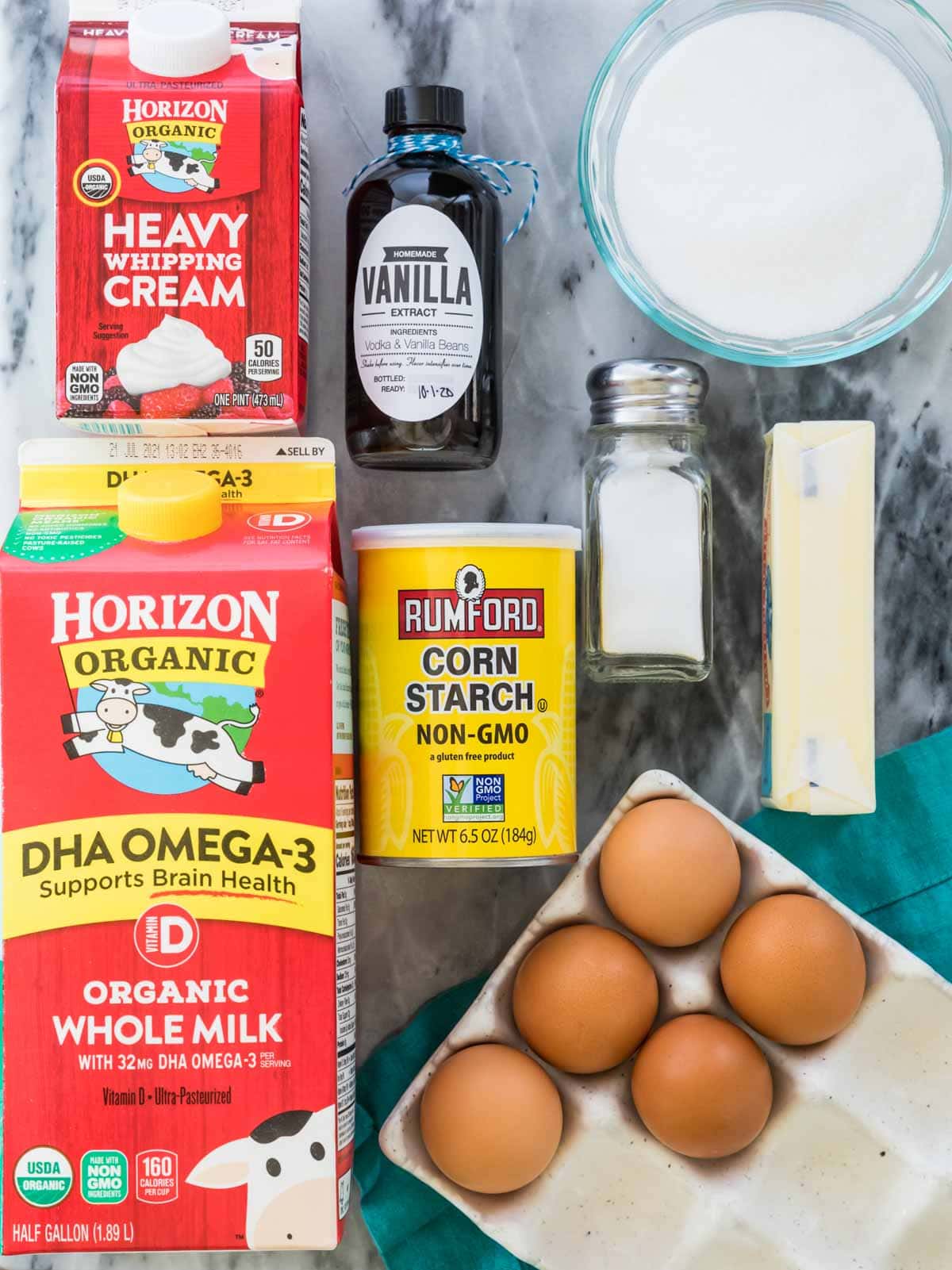 Overhead view of ingredients including cream, milk, corn starch, and more.