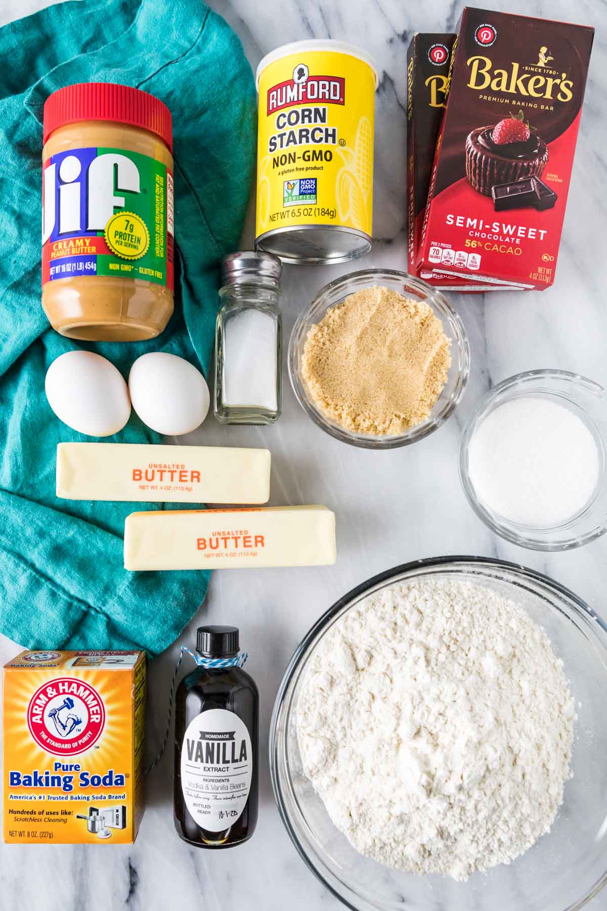 Overhead view of ingredients including peanut butter, corn starch, chocolate, and more.