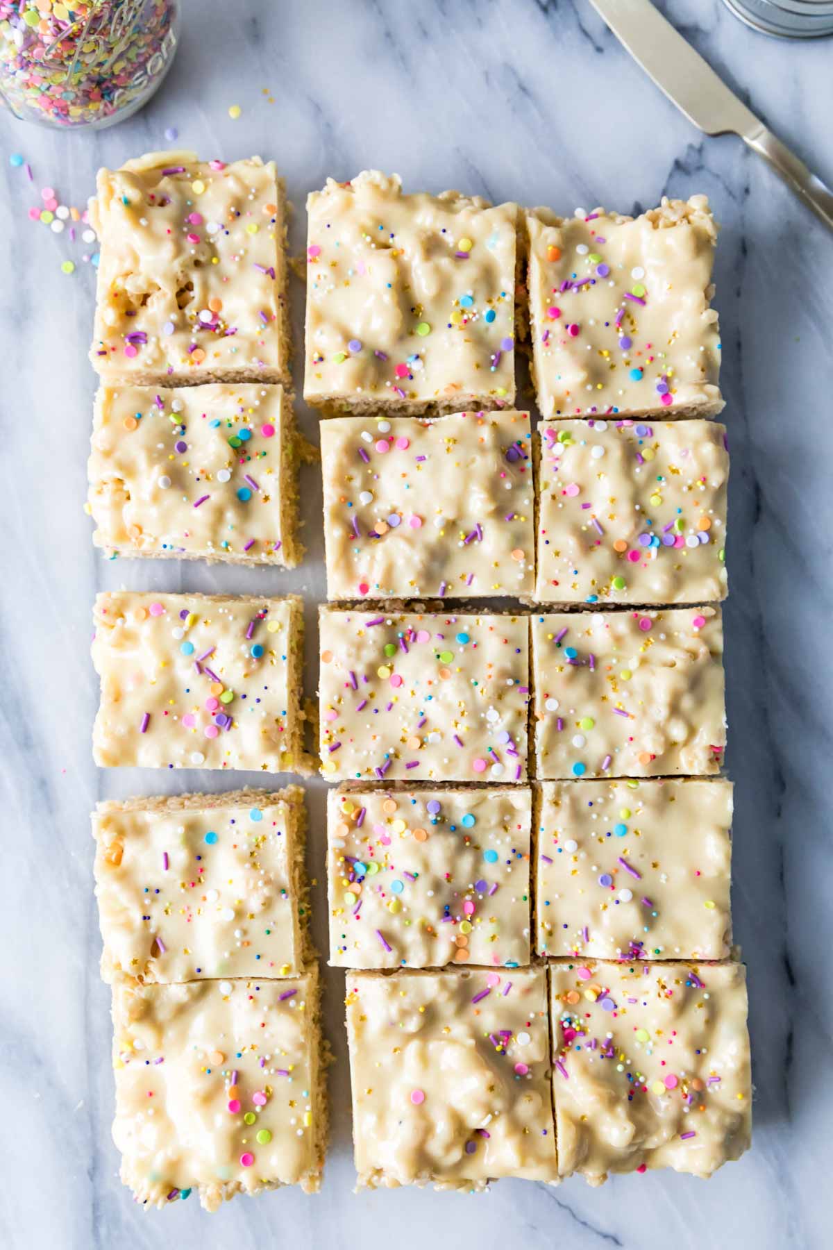 Overhead view of cake batter rice krispie treats after cutting into squares.