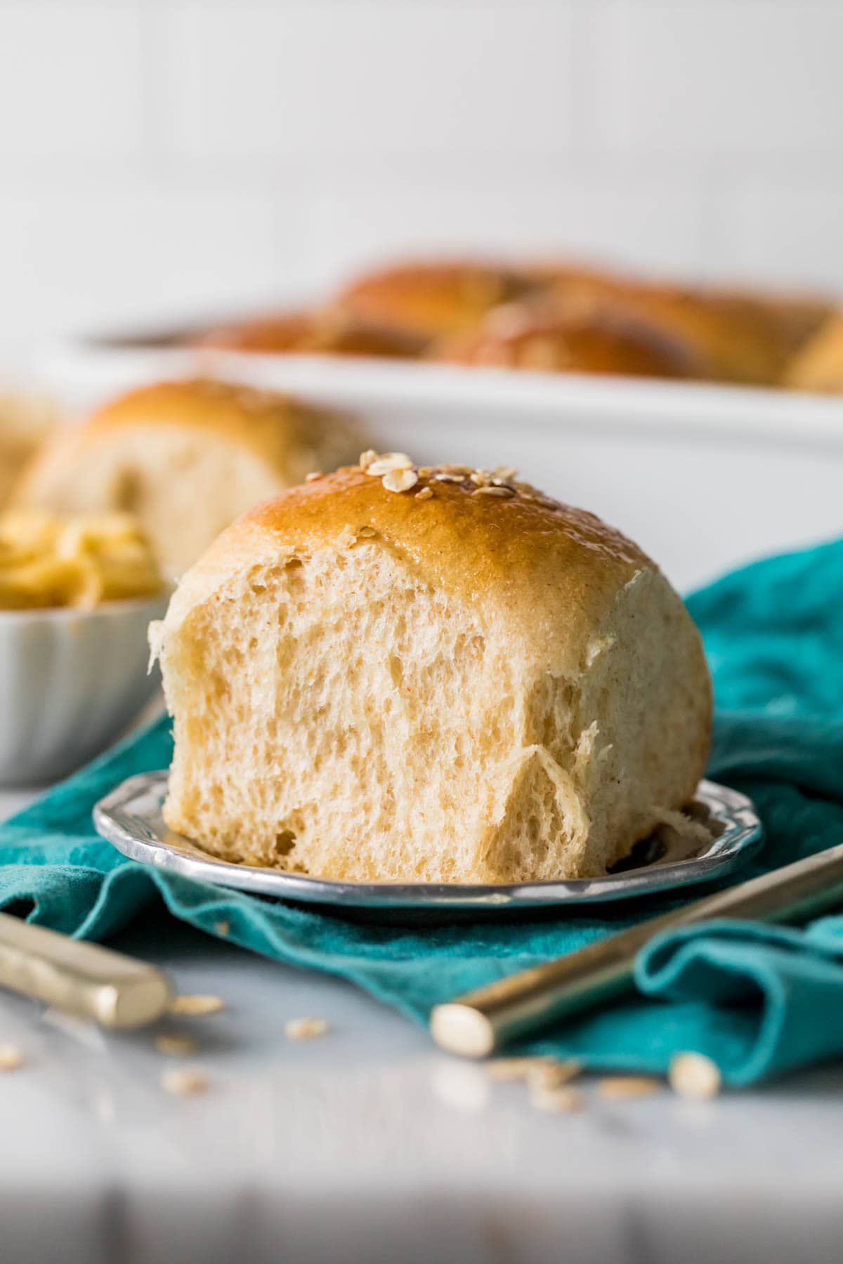 Honey wheat roll on a plate.