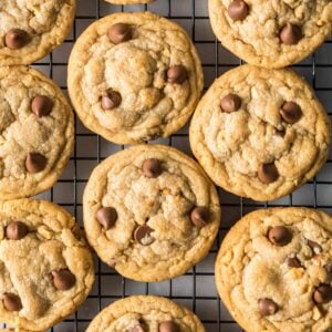 Overhead view of peanut butter chocolate chip cookies on a cooling rack.