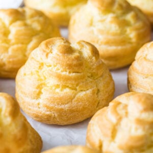 Close-up view of small buns made from choux pastry.