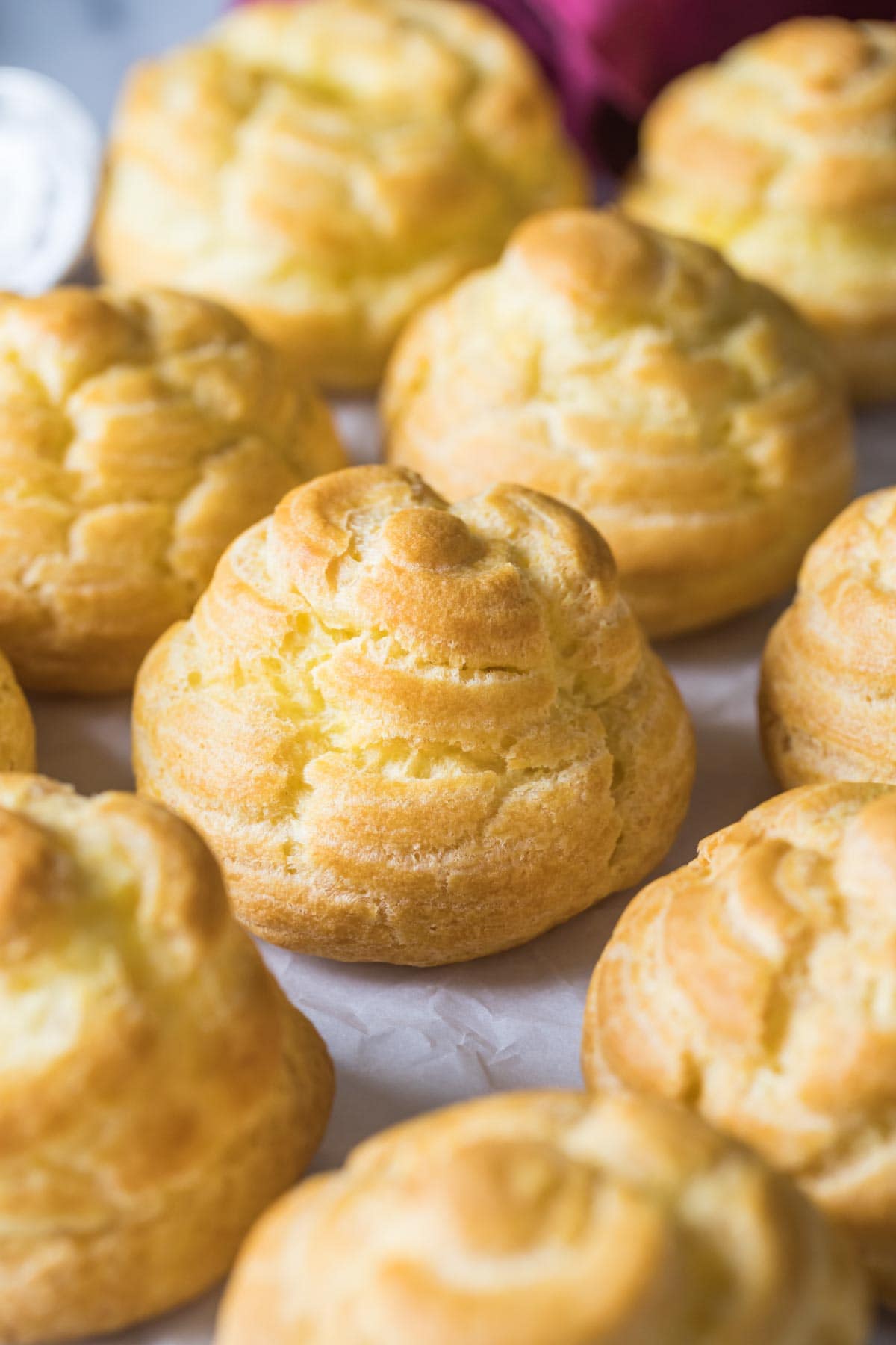 Close-up view of small buns made from choux pastry.