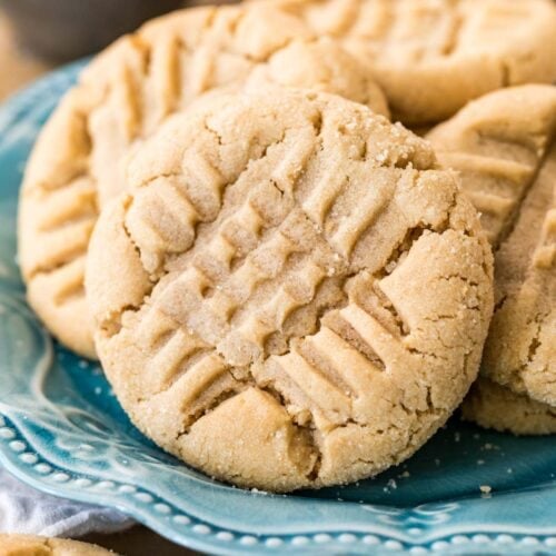Peanut butter cookies with a criss cross fork design on top.
