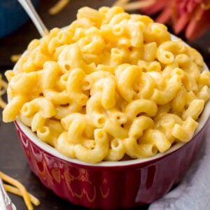 red bowl filled with creamy easy mac and cheese