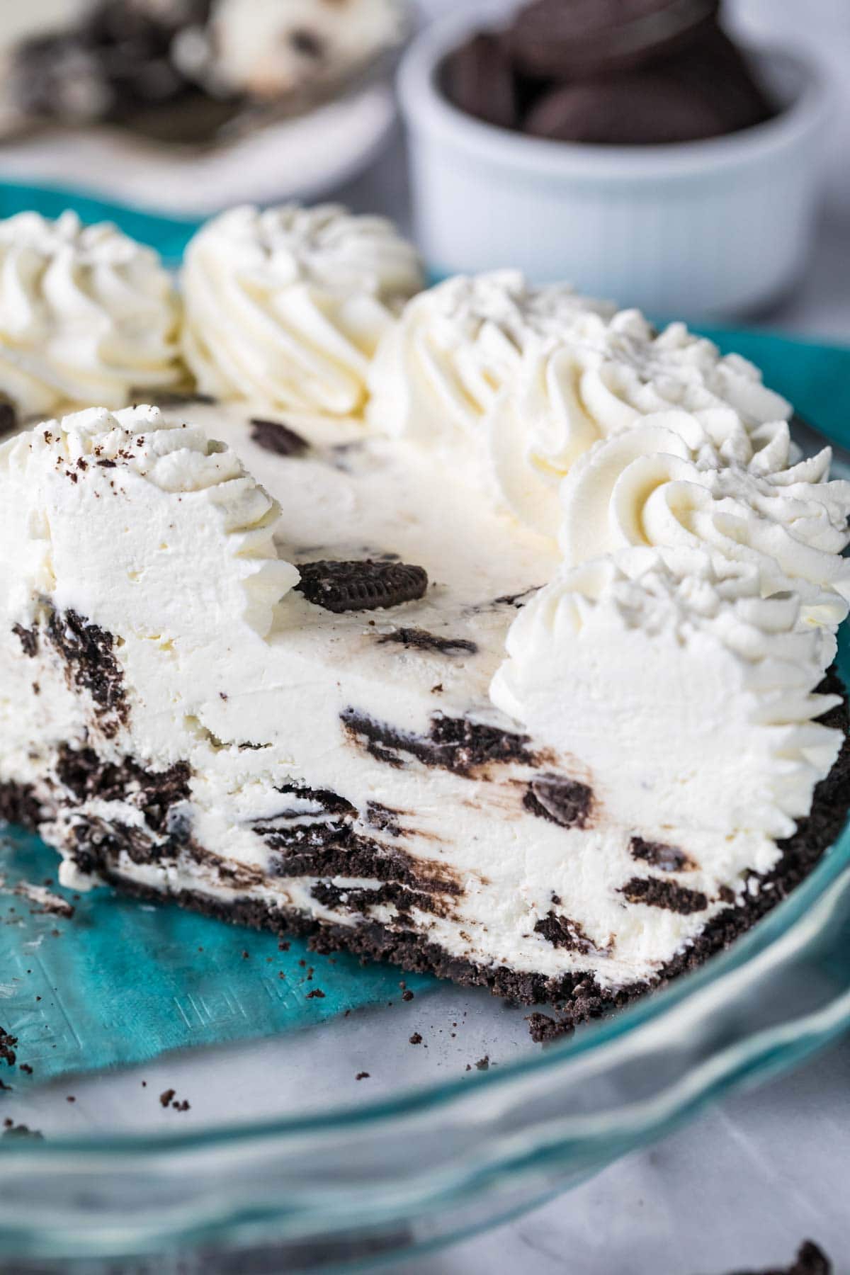 Cross section of pie made with an Oreo crust, creamy Oreo cookie filling, and whipped cream topping.