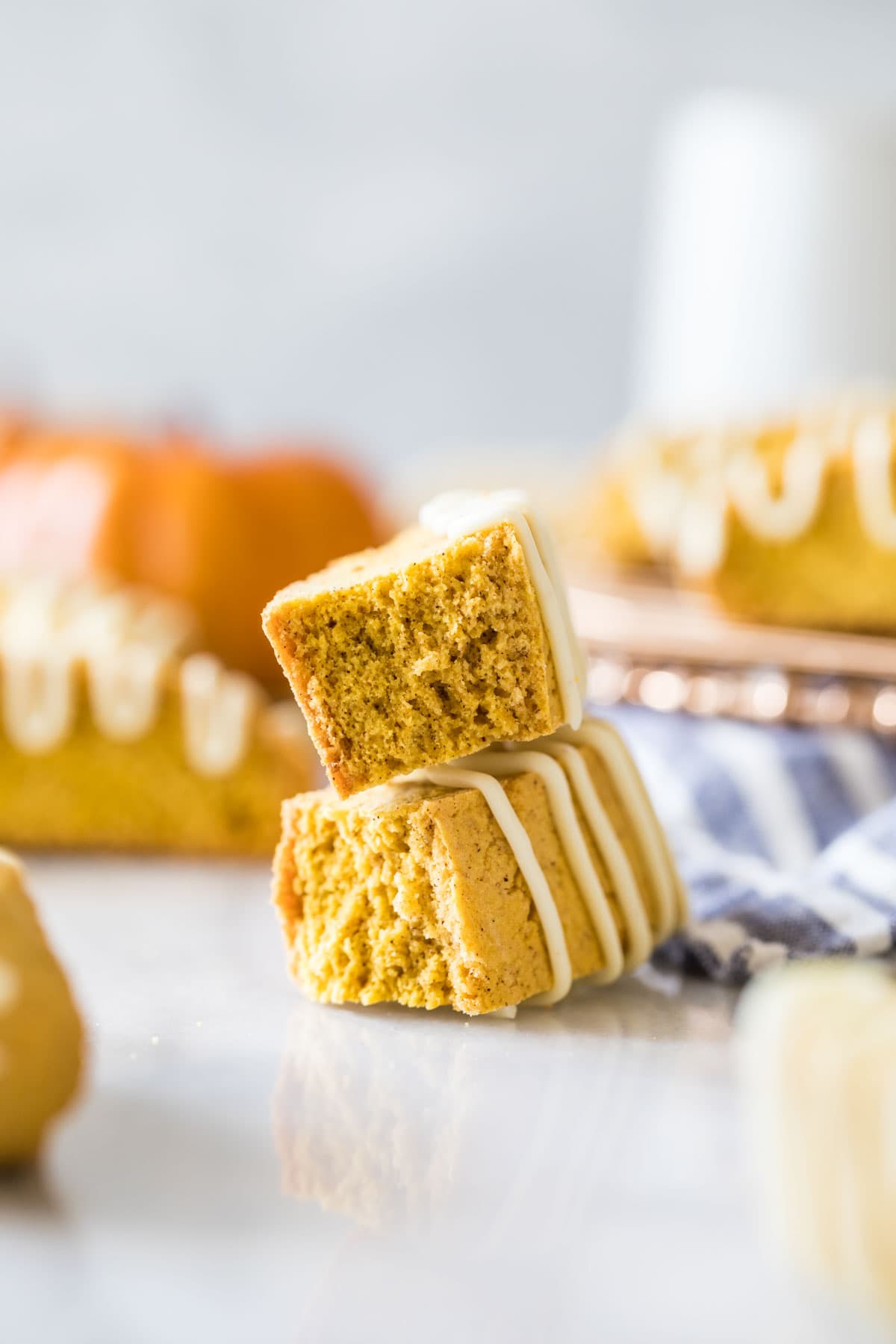 Two halves of a pumpkin cookie stacked on top of each other.