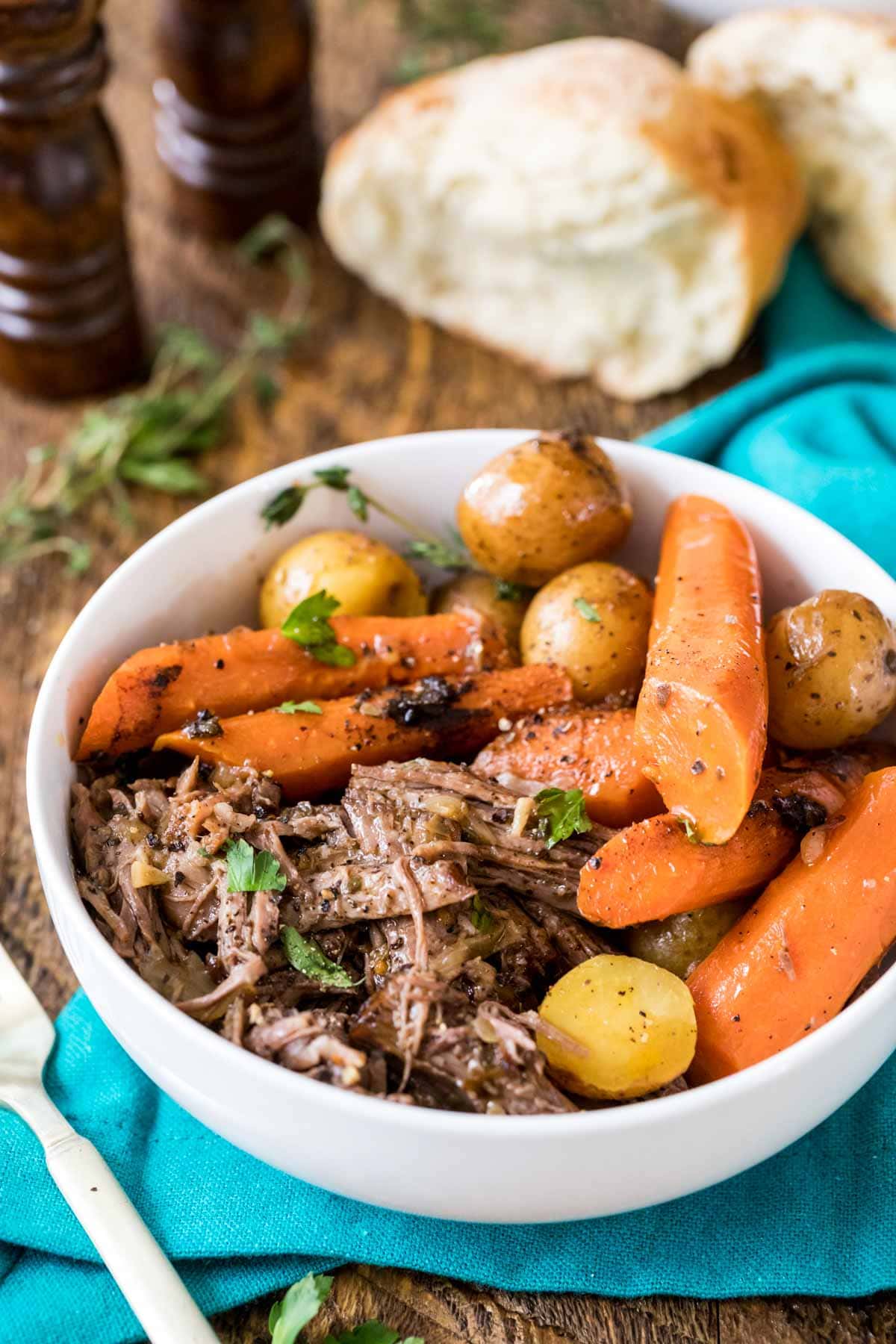 Bowl of shredded beef, carrots, and baby potatoes.