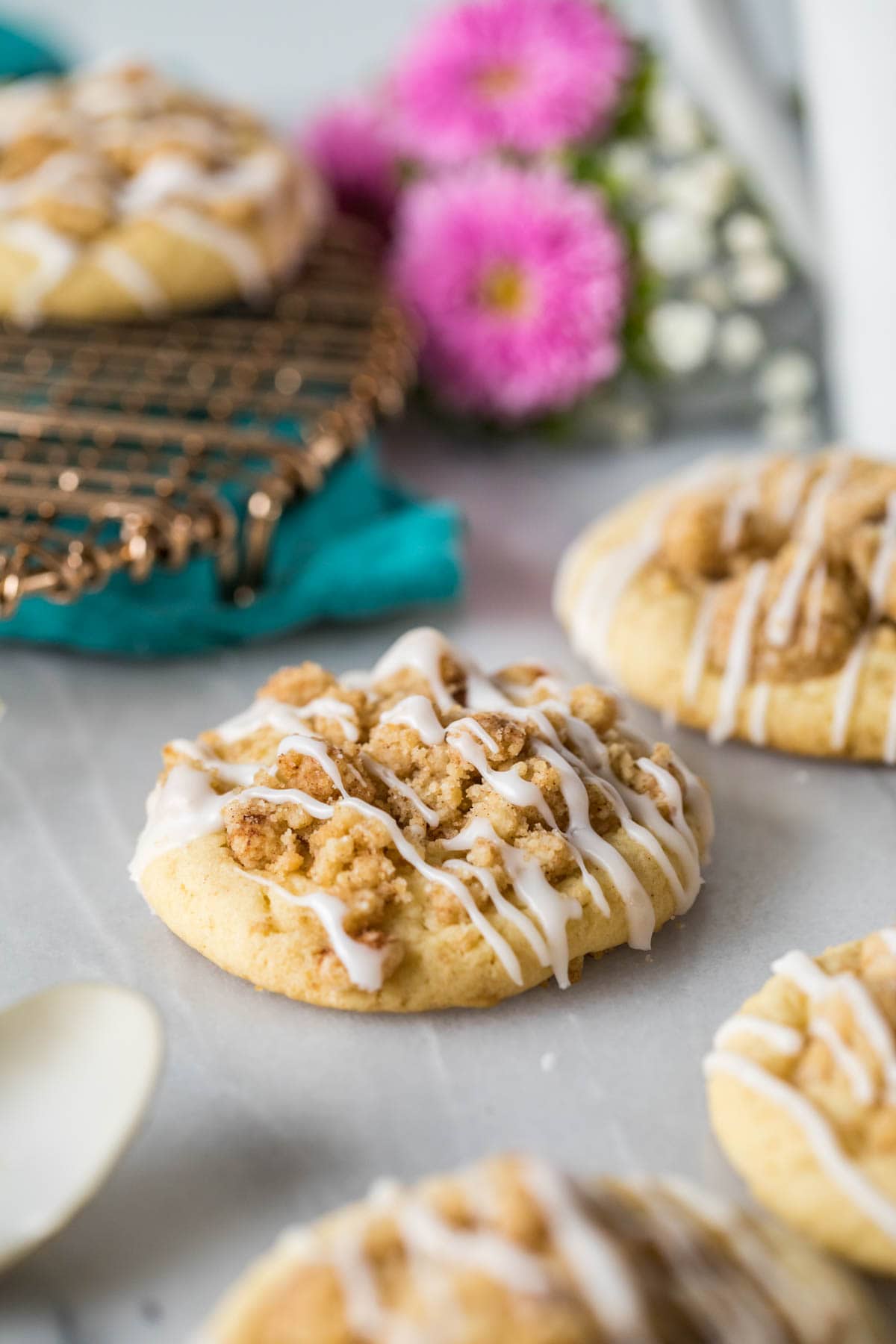 Coffee cake cookies topped with crumbly streusel and vanilla glaze.