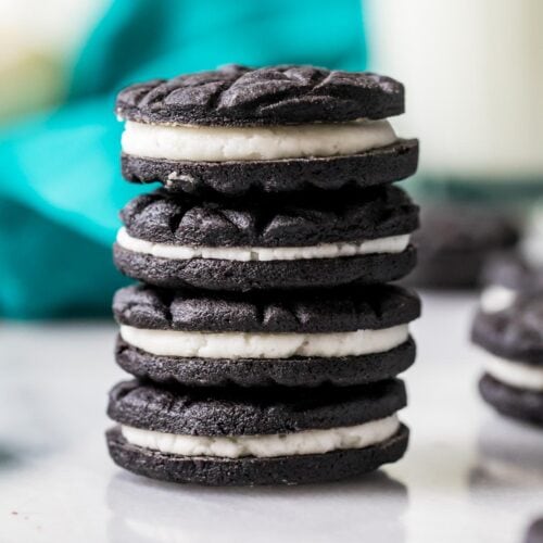 Vertical stack of four cookies made from an oreo cookie recipe.