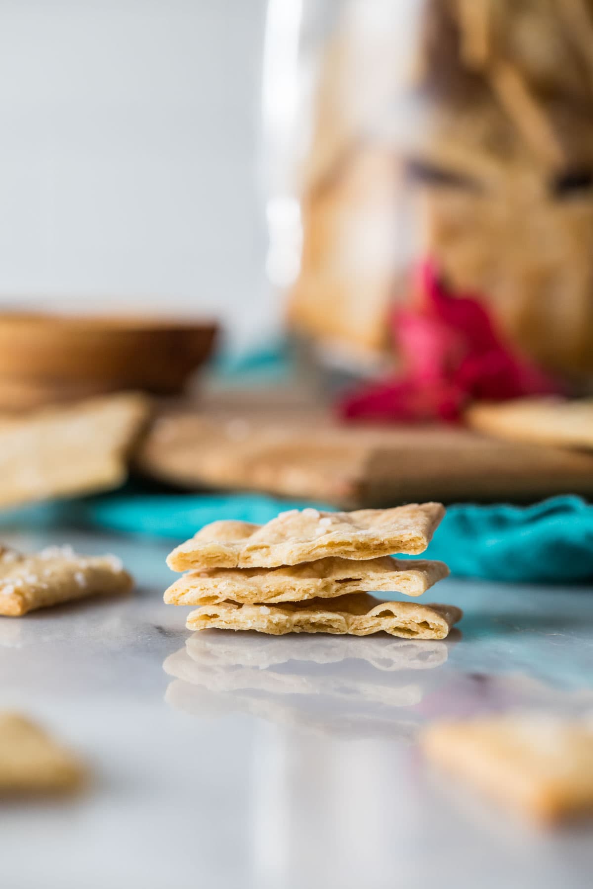 Three crackers stacked on top of each other to show their interior texture.