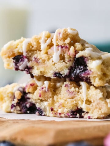 Cross section of blueberry muffin cookies topped with streusel and glaze.