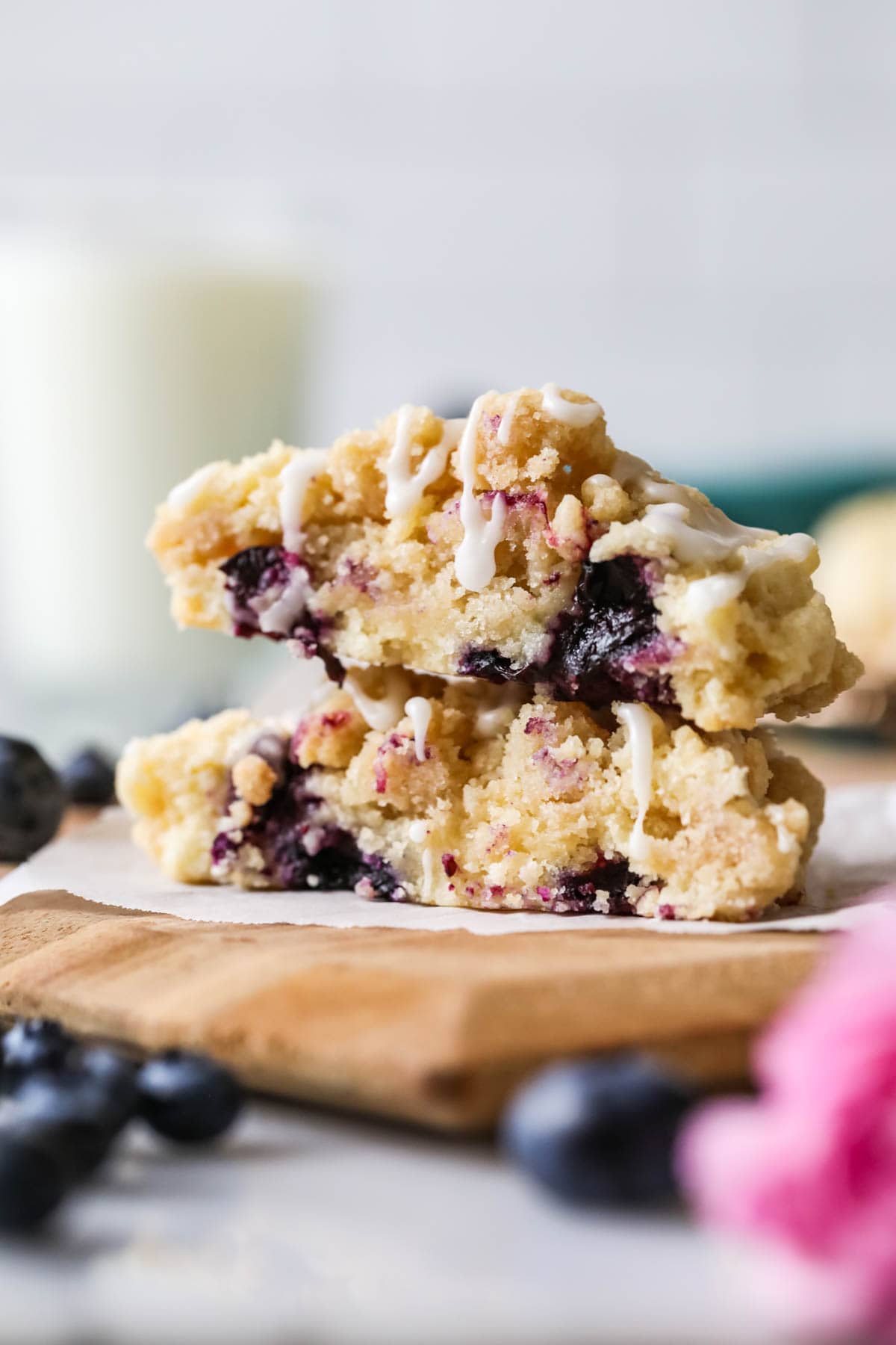 Cross section of blueberry muffin cookies topped with streusel and glaze.