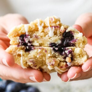 Cross section of blueberry muffin cookies topped with streusel and glaze.