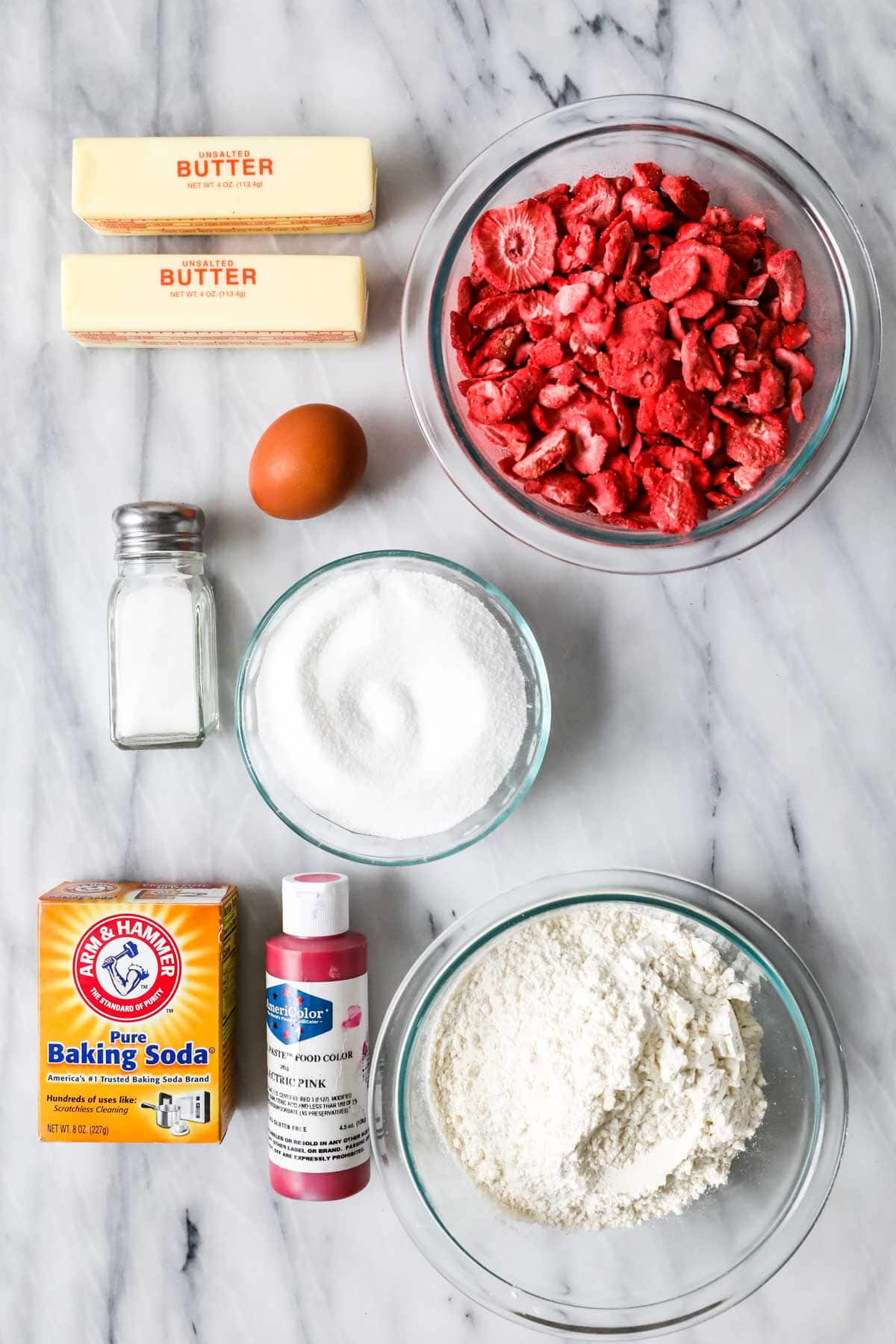 Overhead view of ingredients including freeze dried strawberries, butter, egg, and more.