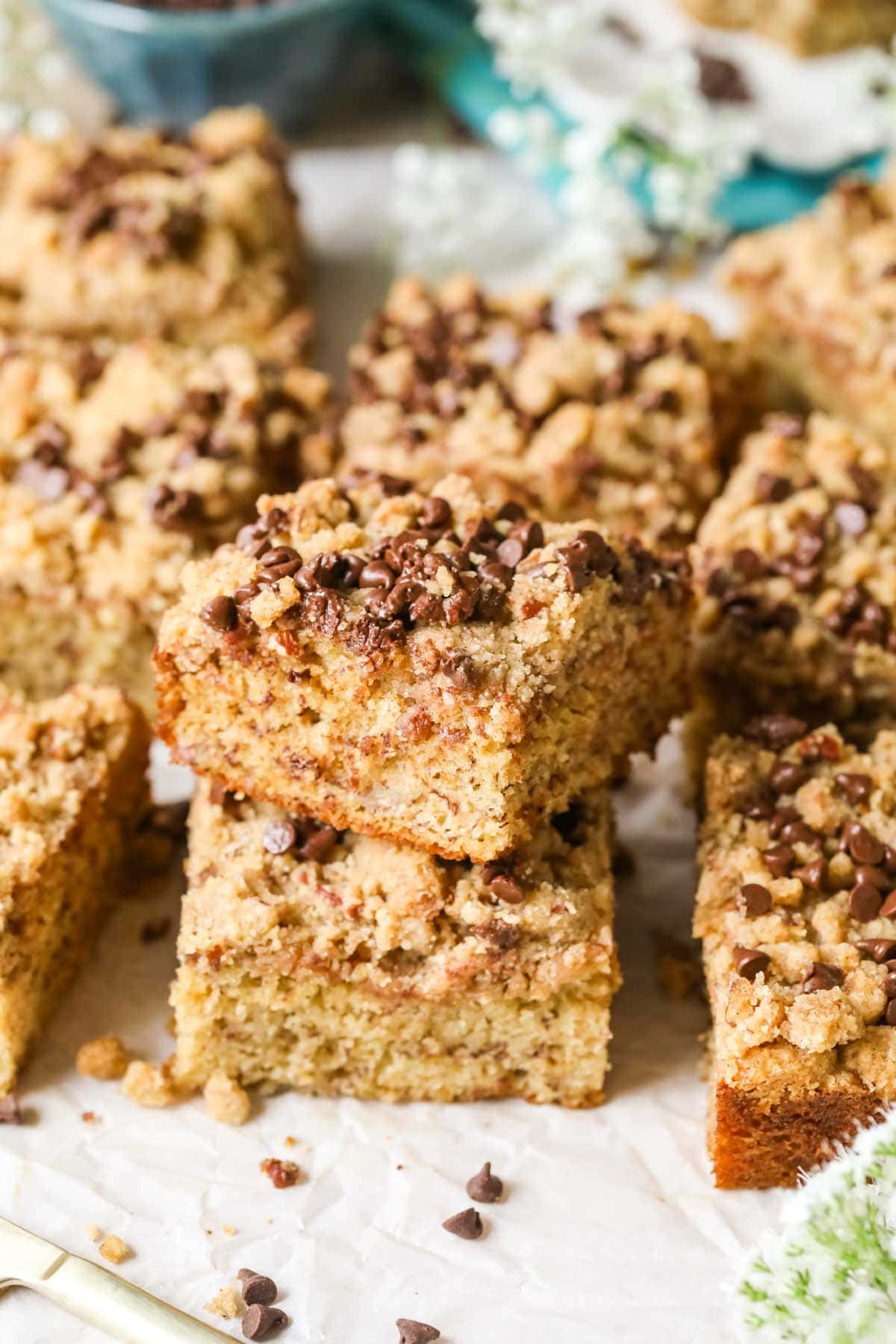 Pieces of banana coffee cake stacked on top of each other.