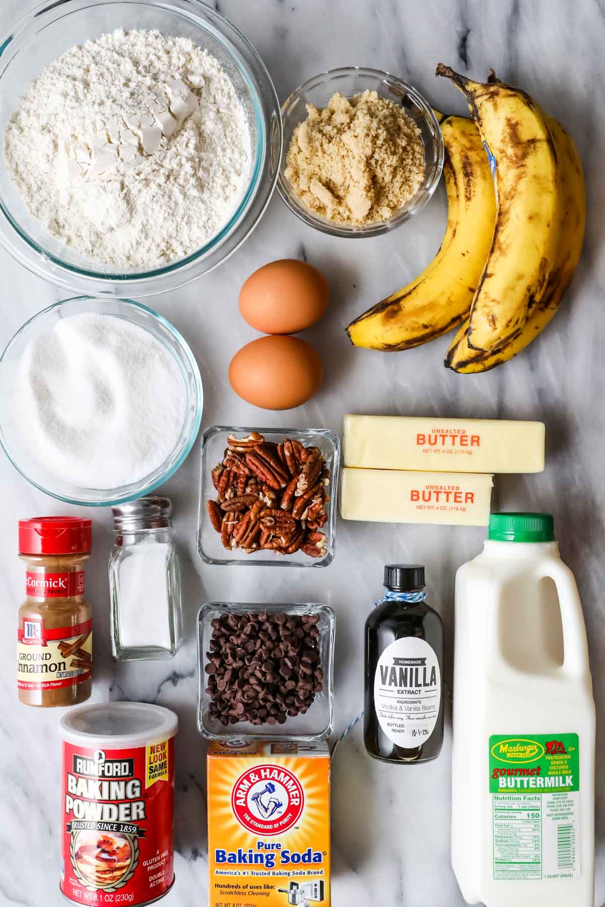 Overhead view of ingredients including bananas, brown sugar, buttermilk, and more.