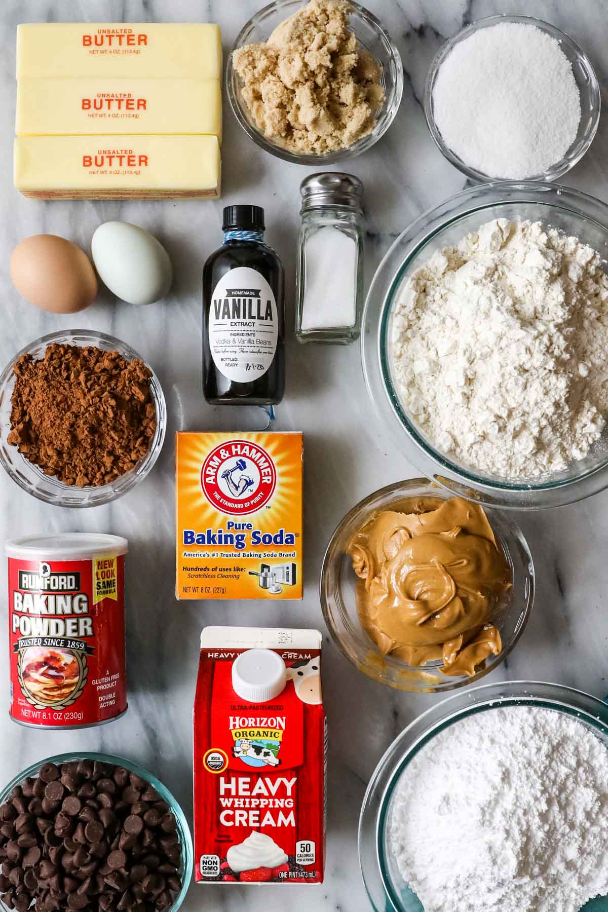 Overhead view of ingredients including brown sugar, cocoa powder, peanut butter, and more.
