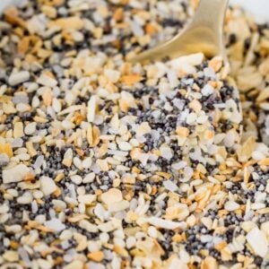 Close-up shot of everything bagel seasoning being scooped with a spoon.