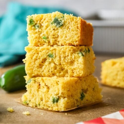 Stack of three pieces of jalapeno cornbread.