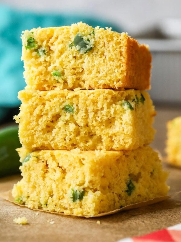 Stack of three pieces of jalapeno cornbread.