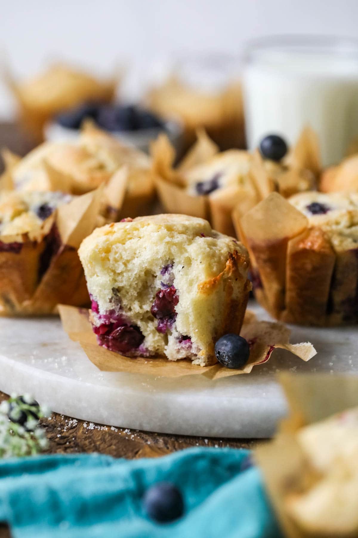 Blueberry muffin made with sourdough discard missing a bite.