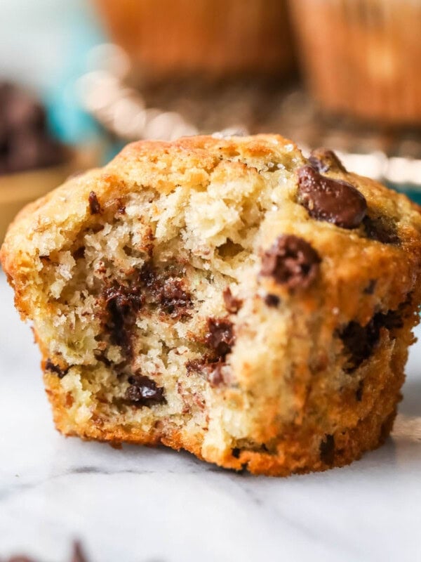 Chocolate chip banana muffin with one bite missing.