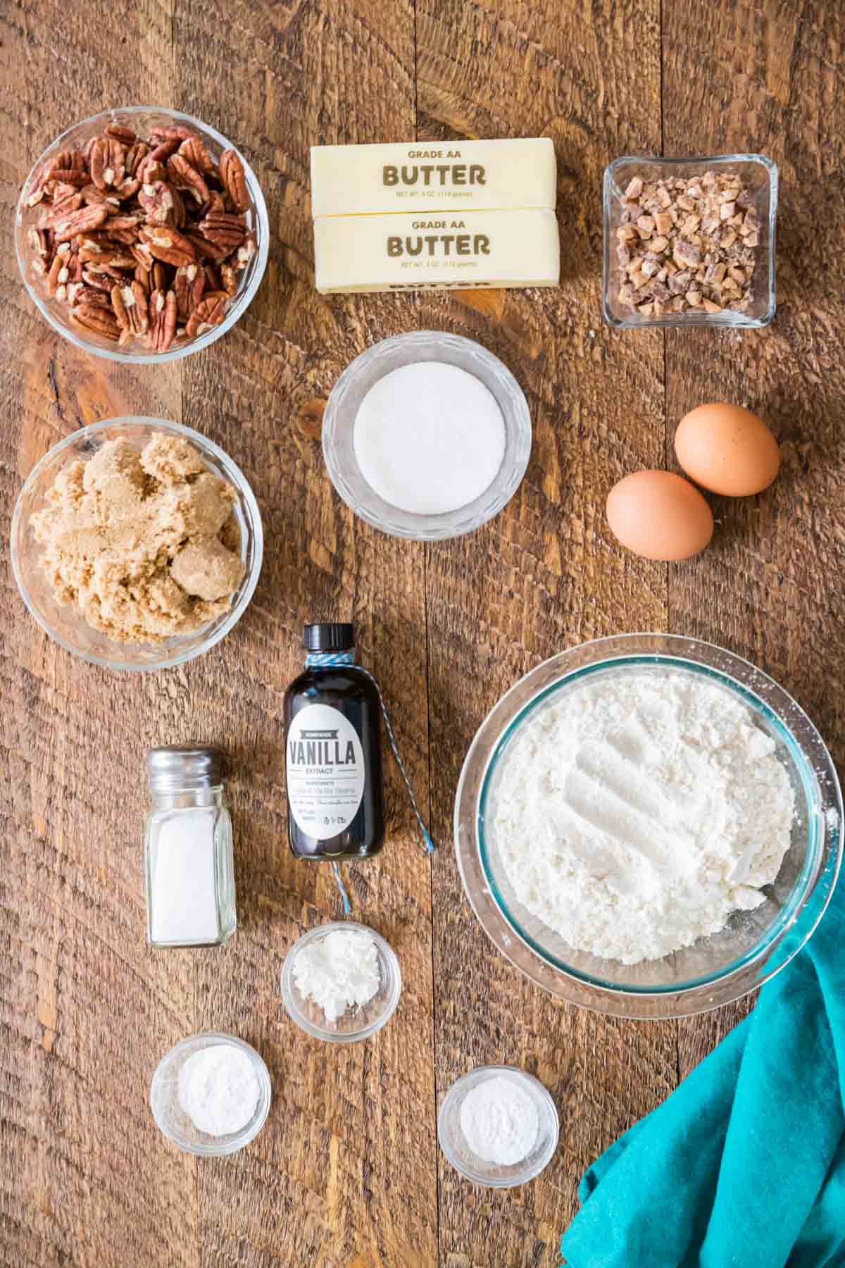 Overhead view of ingredients including pecans, brown sugar, toffee bits, and more.