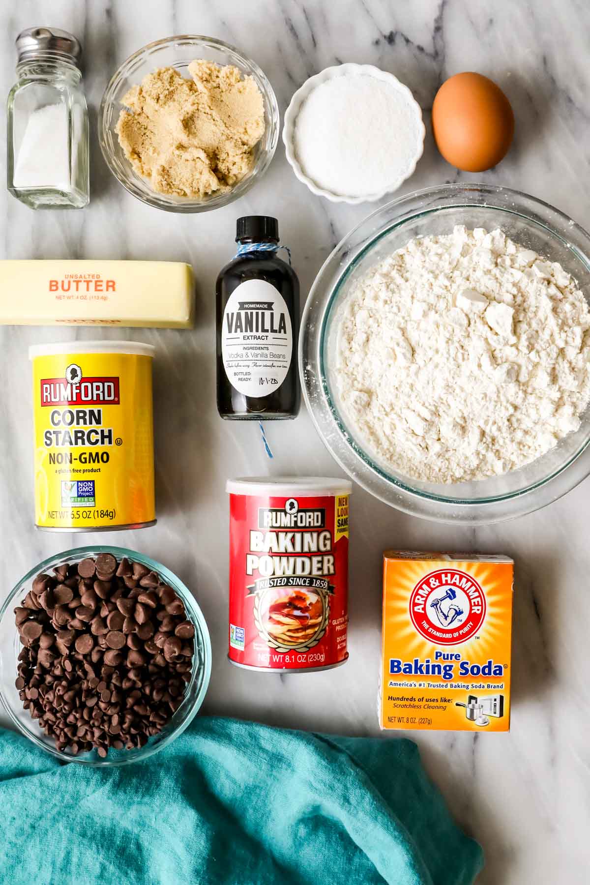 Overhead view of ingredients including chocolate chips, corn starch, brown sugar, and more.