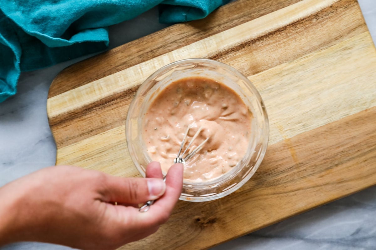 Burger sauce being whisked together.