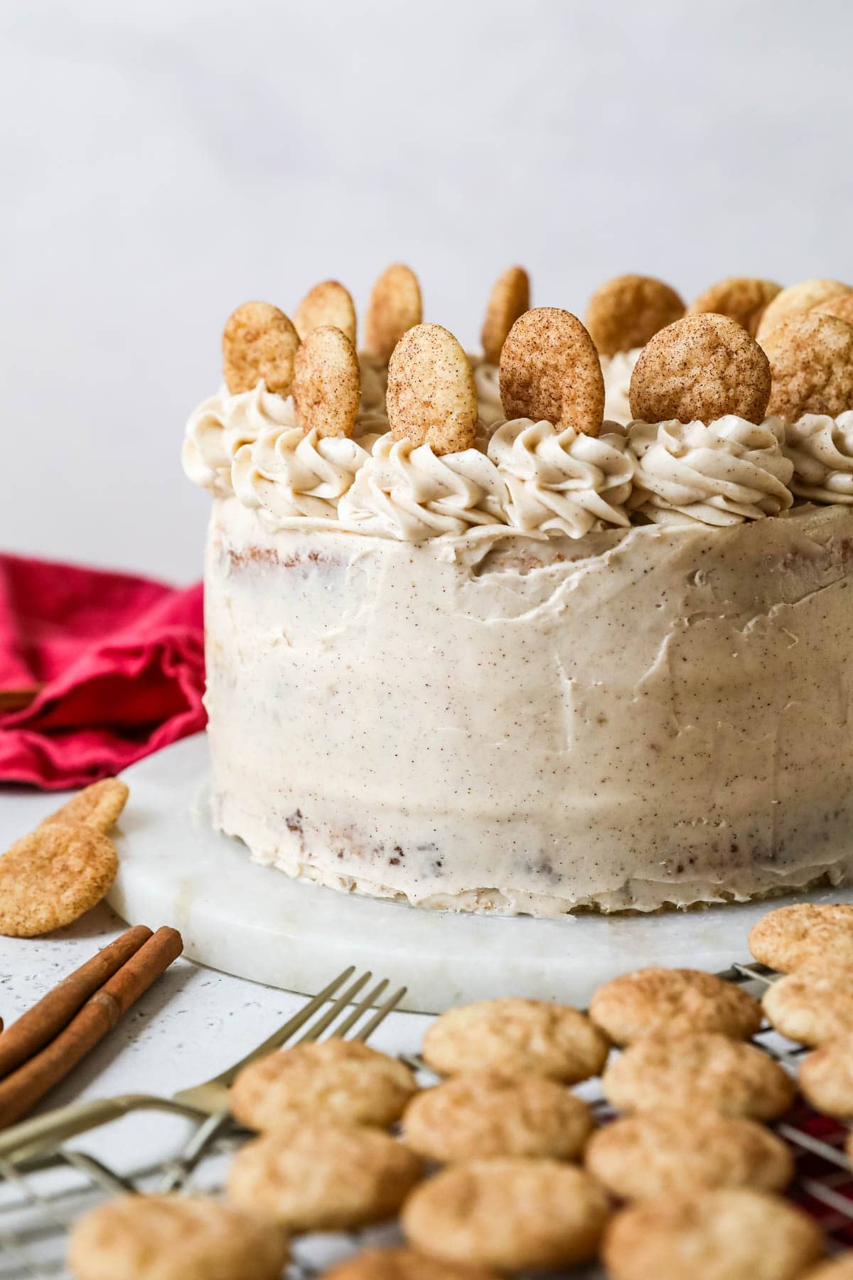 Cake decorated with cinnamon frosting and snickerdoodle cookies.